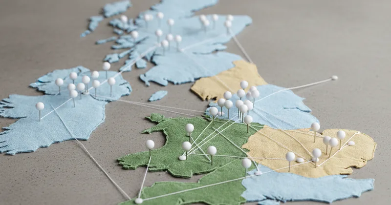 stylised regional abstract visualisation with map pin markers on a flat neutral surface